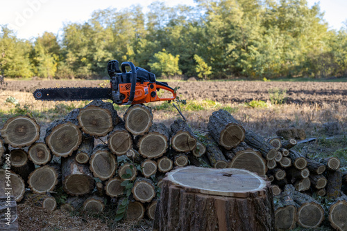 Chainsaw on a wooden stump or wood.