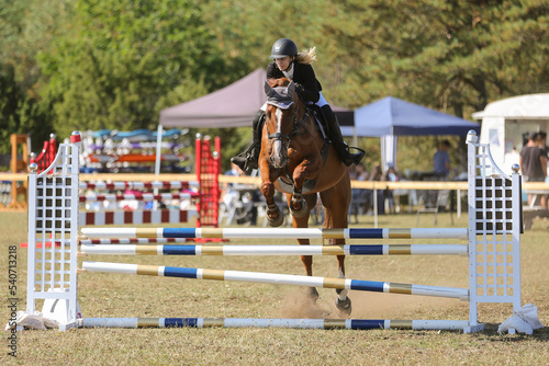 A girl and her horse in show jumping, Gotland Sweden.