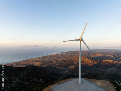 Greece, Aegean, Kos, Hilltop wind turbine at dawn photo