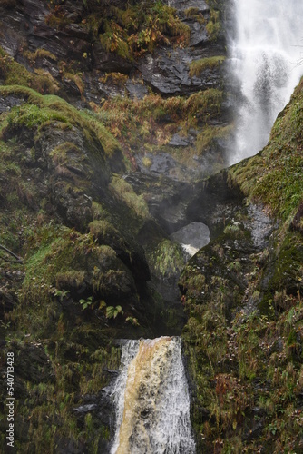 the tall Pistyll Rhaeadr waterfall in north wales from the bottom of it