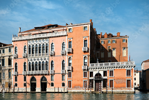 Architecture of Venice, Italy. Palazzo and historic houses in the water of Grand Canal. Traditional Venetian architecture with reflections in water.