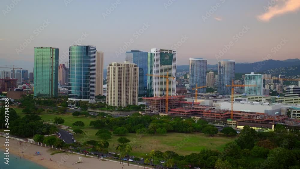 Aerial Shot Of Modern Buildings In City, Drone Flying Forward Over Beach - Oahu, Hawaii Aerial Shot Of Modern Buildings In City, Drone Flying Forward Over Beach - Oahu, Hawaii
