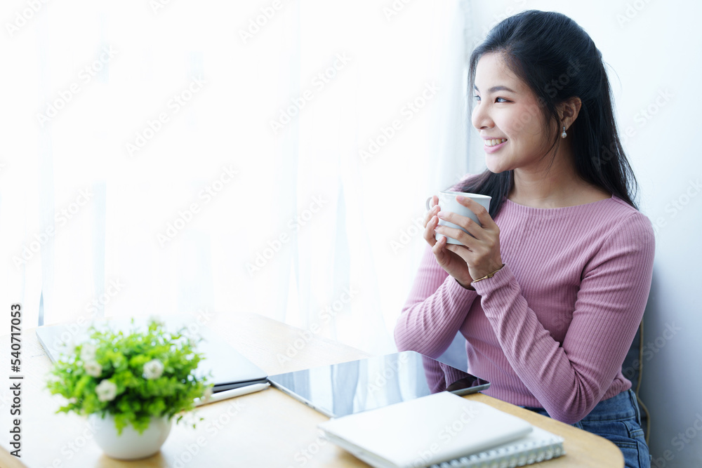 Portrait of a beautiful Asian teenage girl taking a coffee break during the day Portrait of a beautiful Asian teenage girl taking a coffee break during the day