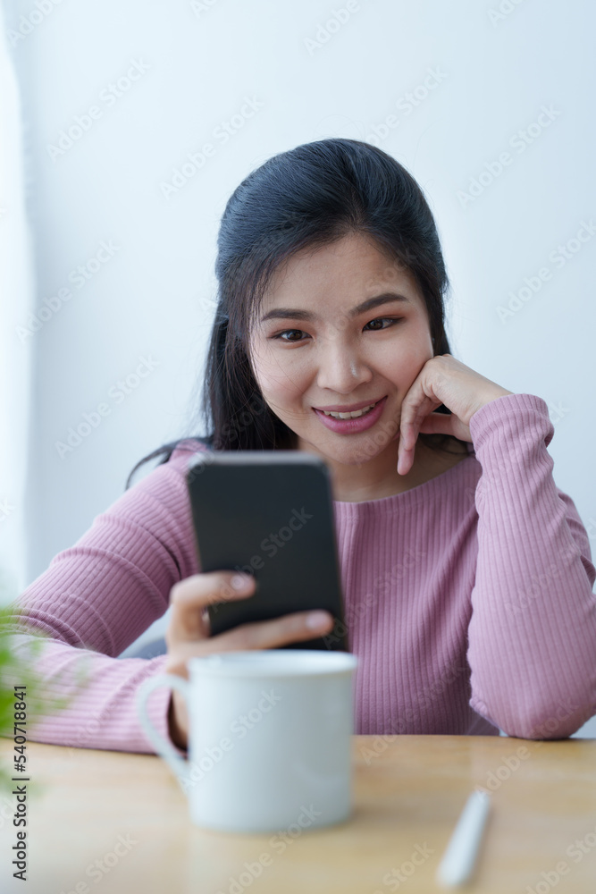 Portrait of a beautiful Asian teenage girl using a smartphone mobile Portrait of a beautiful Asian teenage girl using a smartphone mobile