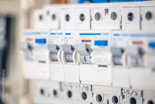 Fotografija Close up circuit breakers and wire in control panel.