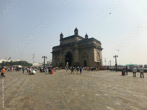 Mumbai, India, November 2019 - A group of people walking in front of a crowd