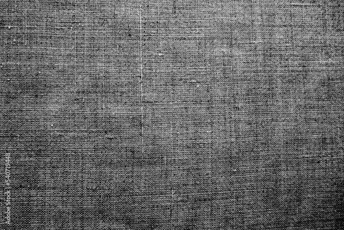 Fabric texture background. Gray fabric with weave. Natural slightly wrinkled look of the material. Uniform copy space background. Cotton, canvas or woolen thin fabric laid evenly on the surface.