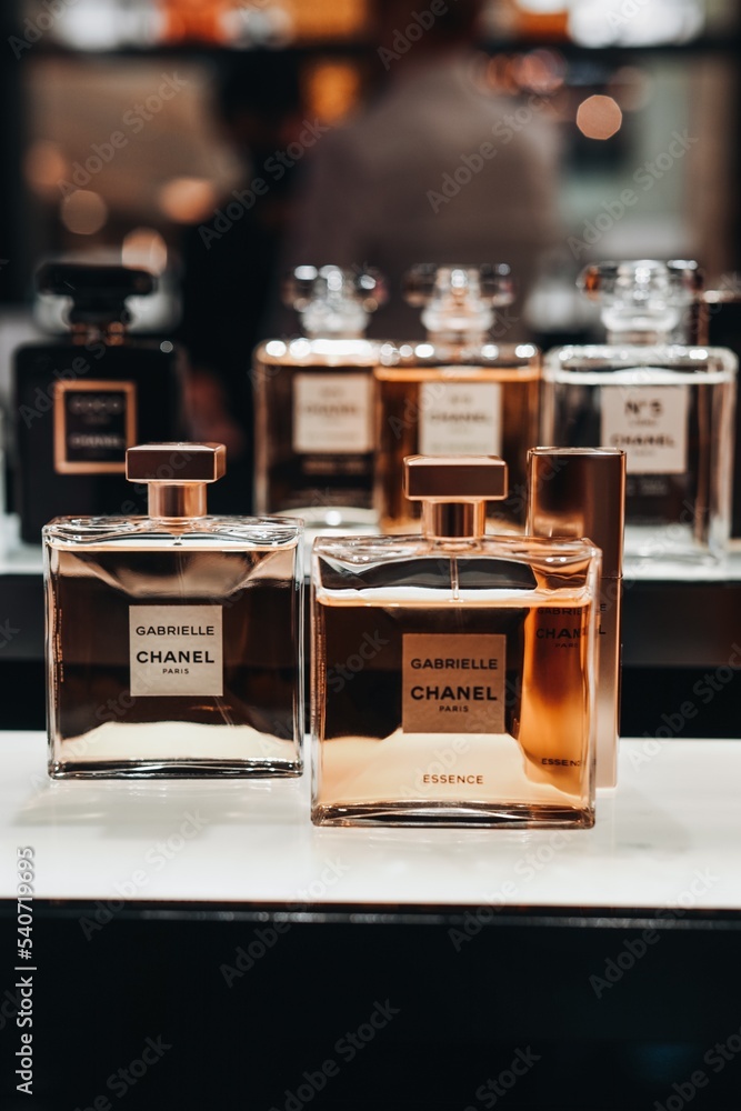 Golden glass bottles perfume, the first perfume launched by French Gabrielle "Coco" Chanel. Luxury perfumery. Stock Photo Adobe Stock
