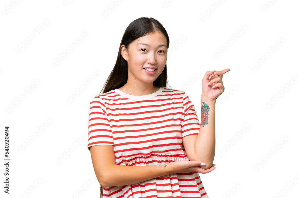 Young Asian woman over isolated background posing with arms at hip and smiling Young Asian woman over isolated background posing with arms at hip and smiling