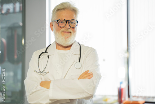 an elderly gray-haired male doctor in a medical office
