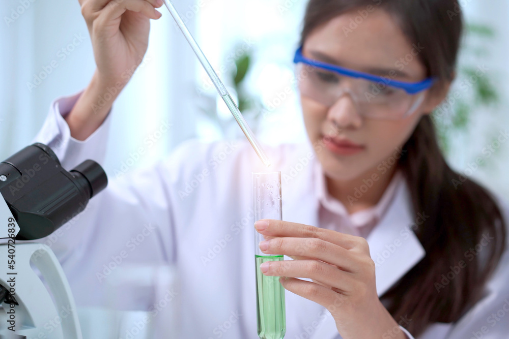 Team of biology researcher and scientist doing the biotechnology experiment in laboratory, scientist dropping a chemical or solution into the science sampling in a experimental tube. Team of biology researcher and scientist doing the biotechnology experiment in laboratory, scientist dropping a chemical or solution into the science sampling in a experimental tube.
