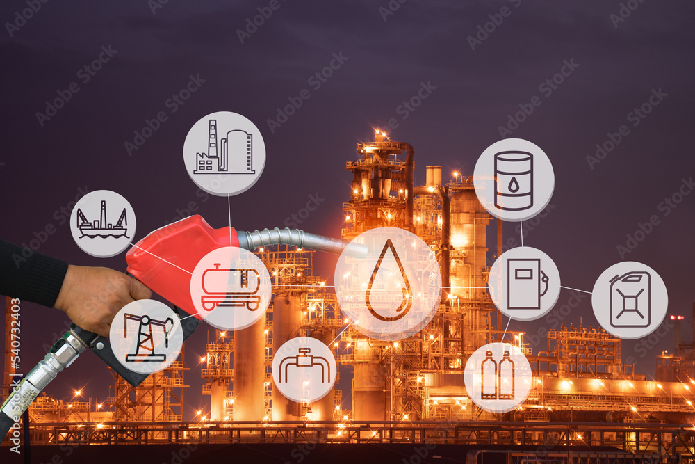 hand holding fuel nozzle Car Gas Tank Fueling over the petrochemical