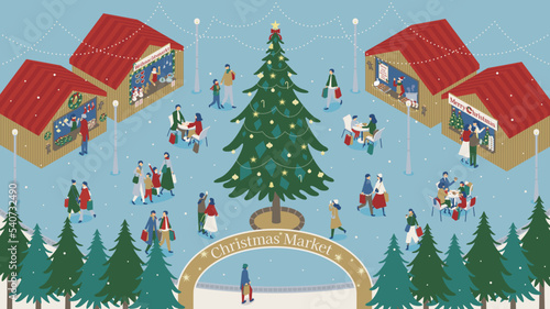 雪の降るクリスマスマーケットを楽しむ人々