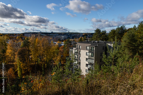 Lahti, Finland in autumn colors. Cityscape in the background and apartment building in the foreground