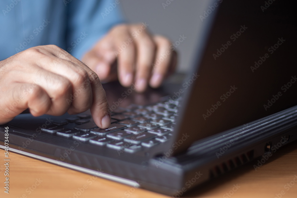 male hand presses keyboard keys to enter data male hand presses keyboard keys to enter data