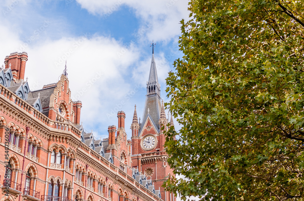 Naklejka premium Exterior view of St Pancras Railway Station. This building now houses the luxury St Pancras Renaissance Hotel, London, England, UK, October 15, 2022
