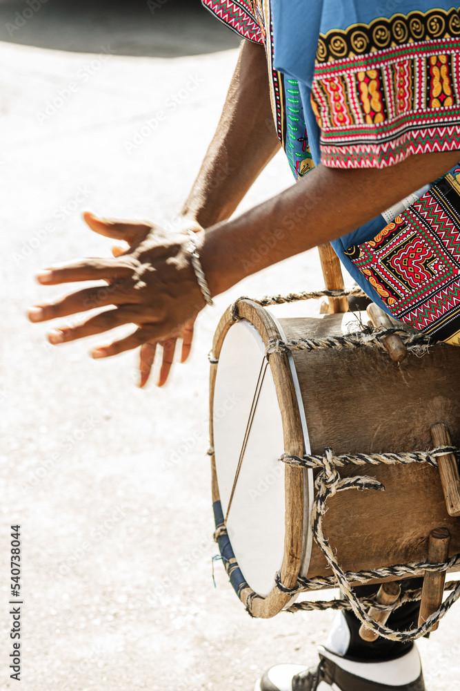A person playing a traditional instrument of the Garifuna culture ...