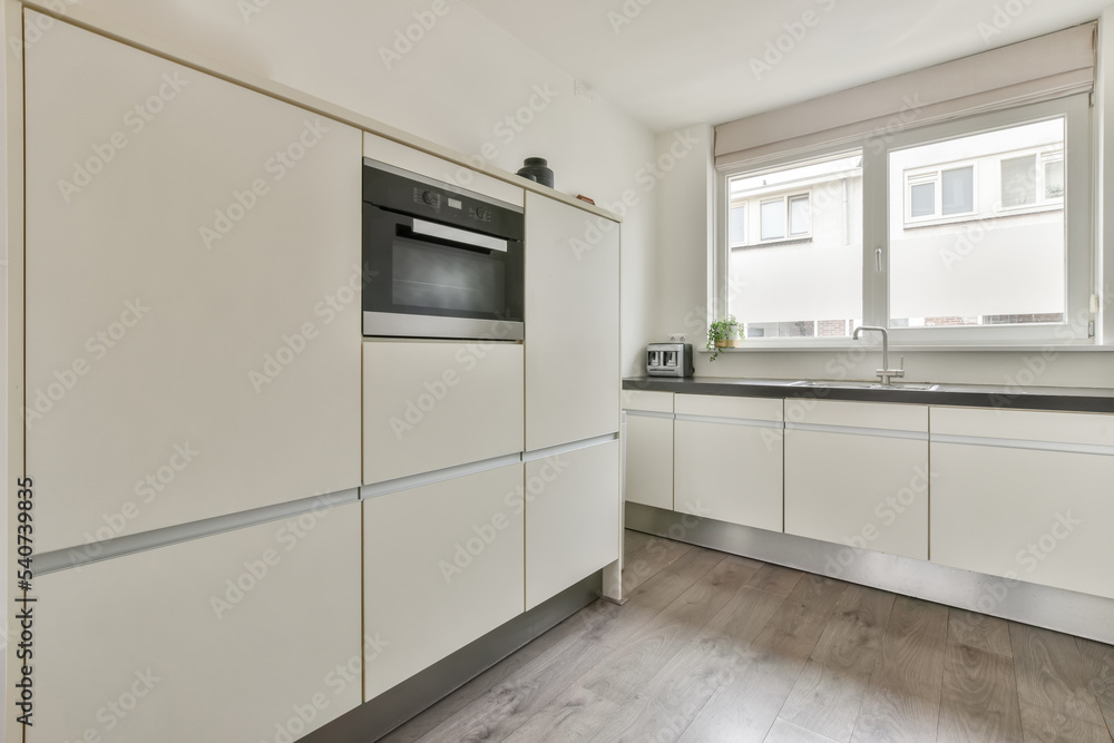 Modern kitchen in flat in minimal style Modern kitchen in flat in minimal style