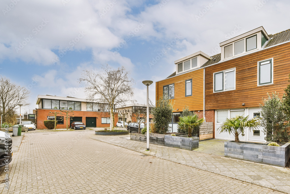 Facade of residential house with parking lot Facade of residential house with parking lot