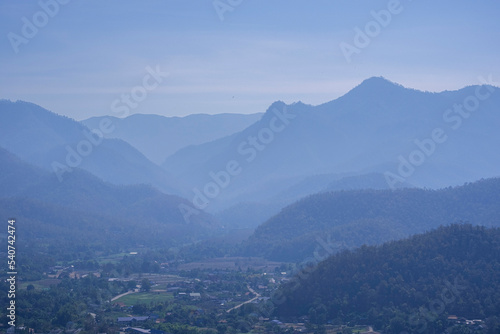 Beauty high mountain multi layer with green tree. high forest fresh air and fog in morning sunrise blue sky. Thailand tropical view in natural park. © Topfotolia