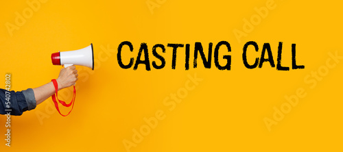 Hand with a megaphone and a casting call text photo