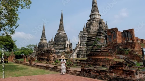 Ayutthaya, Thailand at Wat Phra Si Sanphet, women with a hat and tourist map visiting Ayyuthaya Thailand. Tourist with map in Thailand photo