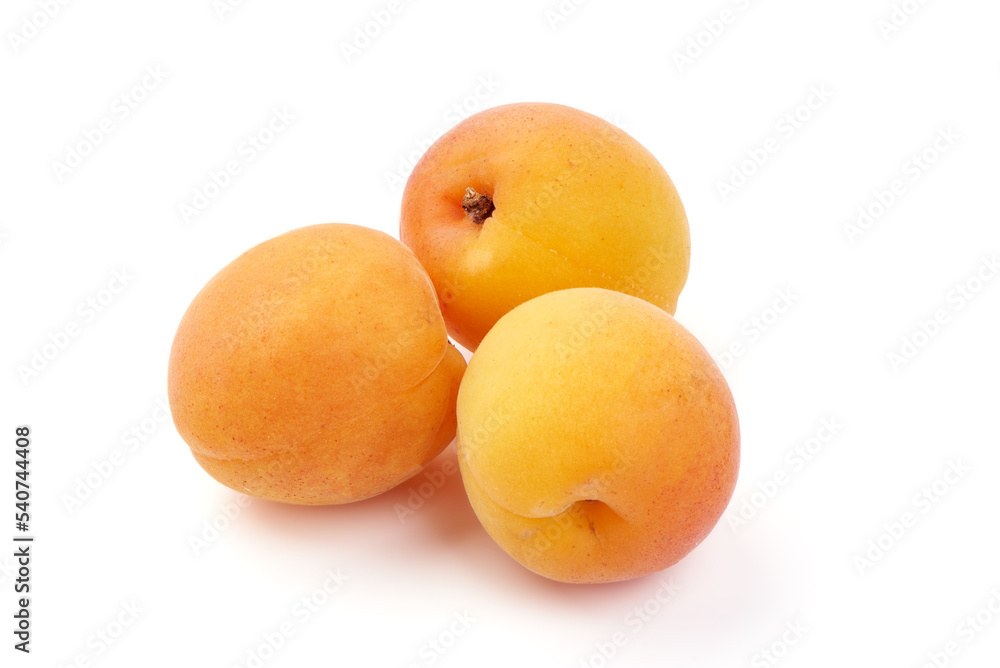 Isolated group of apricots. Two whole apricot, piece, half with leaves isolated on white background with clipping path Isolated group of apricots. Two whole apricot, piece, half with leaves isolated on white background with clipping path