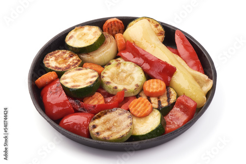 Grilled vegetables ( colorful bell pepper, zucchini, eggplant, onion ) on black Cast iron pan.