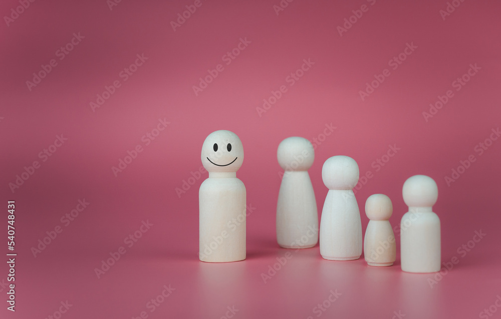 concept Business and HR for leadership and team leader, one wooden dolls stand out in front  Different and stand out from the group