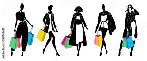 Silhouette of group of women holding shopping bags, winter fashion themed vector illustration.
