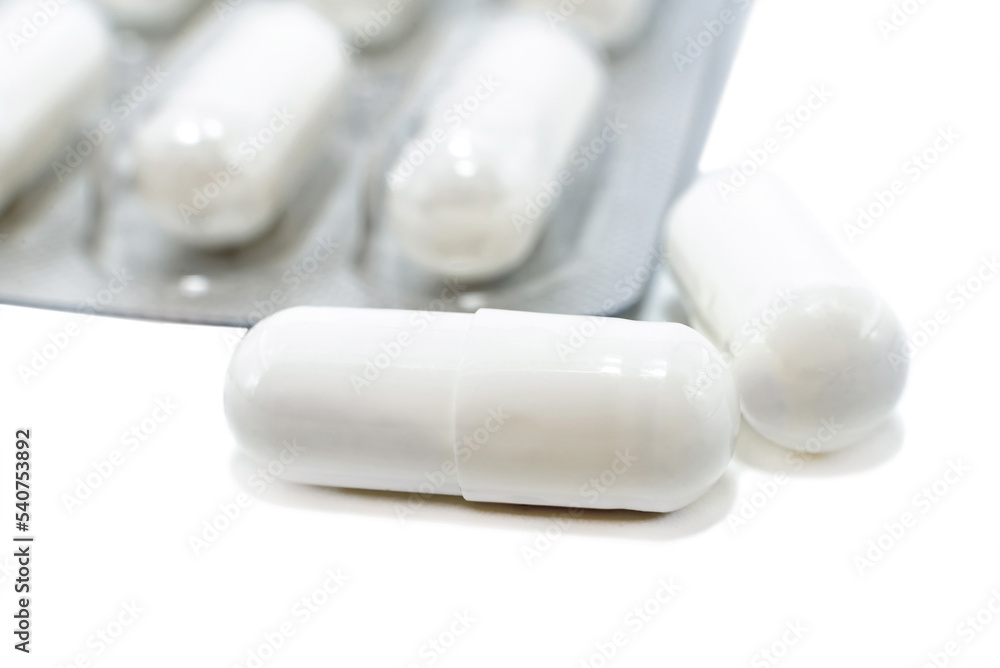 Medical capsules, pills on a white background close-up. Medical drug. Health. Treatment Medical capsules, pills on a white background close-up. Medical drug. Health. Treatment