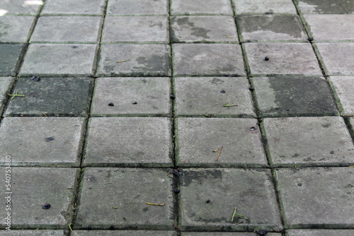 The old grey concrete block pavement texture background