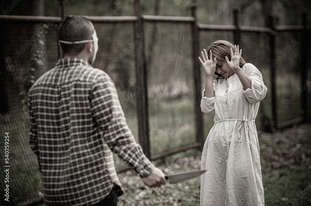 Fototapeta premium A serial killer scene is about to kill an Asian woman,concept thriller scene,Halloween festival