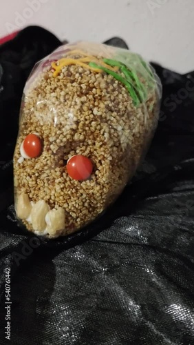 Rich sweet typical of Mexico, representation of the day of the dead, which is celebrated on November 2, sweet amaranth skull. Vertical video.