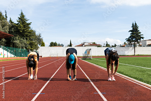 Sportswomen warming up before race photo