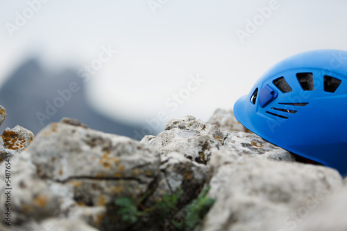 Rock climber's helmet on the mountain, the concept of climbing and sports.