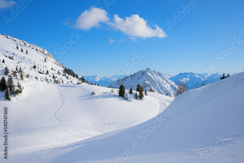 dreamy winter landscape with snow covered slope, ski resort Rofan alps photo