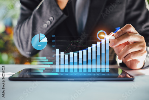 Businessman investment consultant analyzing company financial report statement working with digital augmented reality graphics. Concept for business economy and marketing result. 3D illustration. photo