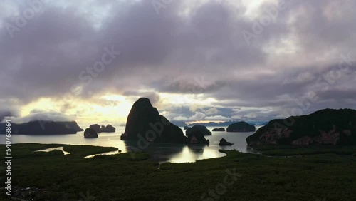 .Aerial top view sunrise at Samet Nangshe, mountain valley hills, .and tropical green forest trees at sunrise with archipelago in Andaman sea in Phang Nga Bay .Thailand. Natural archipelago landscape photo