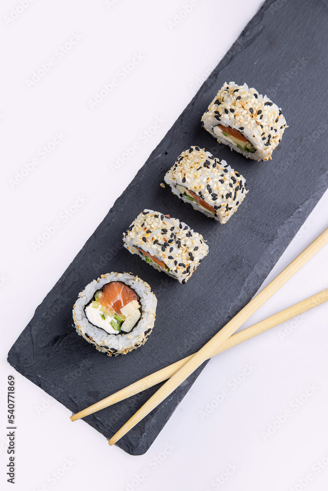 Delicious sushi, rolls with salmon. Japanese cuisine
Delicious sushi, rolls with salmon. Japanese cuisine