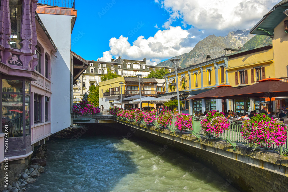 CHAMONIX, FRANCE. View of the  Arve river. Bright houses on the street in the center of Chamonix.