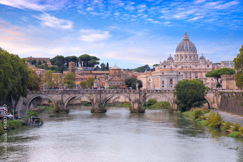 Tiber River in Rome, Italy: view of  bridge Ponte Sant'Angelo; on background Saint Peter's Basilica.