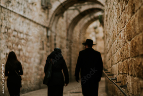 Jewish person walking in the street, old city israel photo