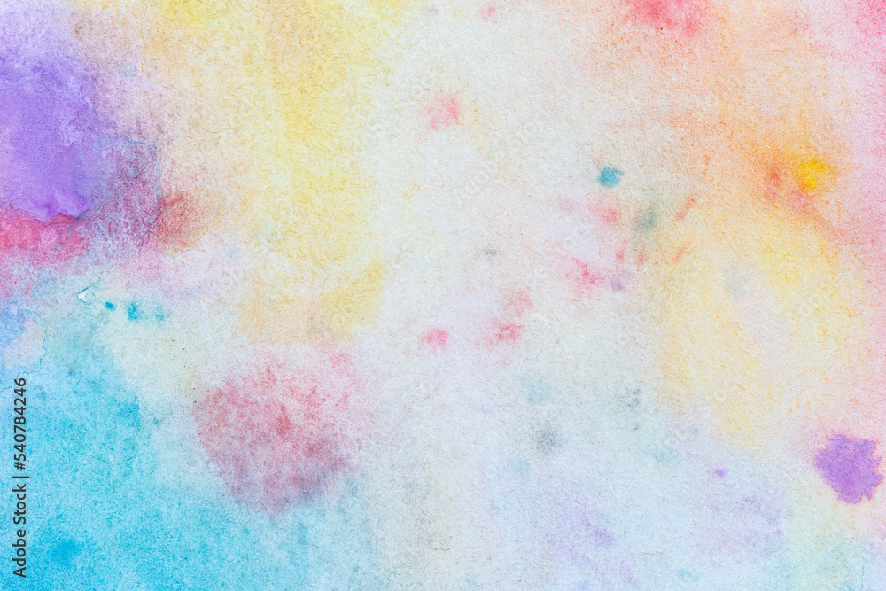 Macro close-up of an abstract colorful watercolor gradient fill background with watercolour stains. High resolution full frame textured white paper background. Copy space.