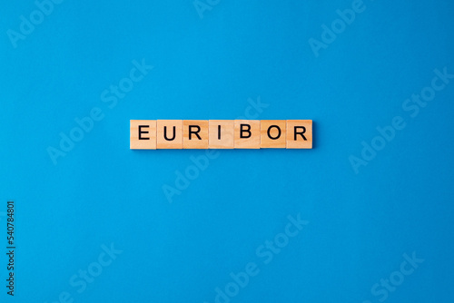 Word EURIBOR Is Written In Wooden Letters On Blue Background. Copy paste.