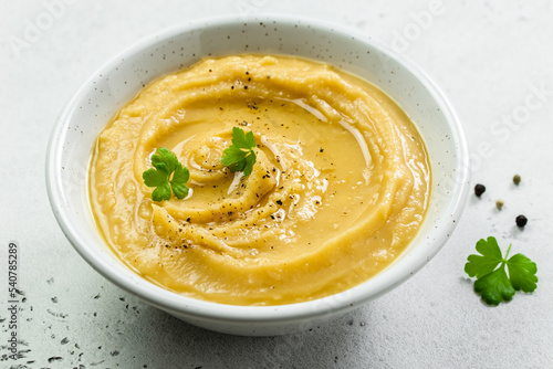 Obraz na plátně Vegetarian split pea soup puree with herbs and olive oil