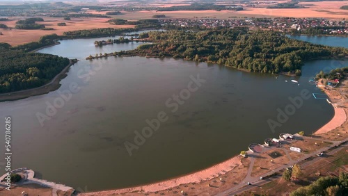 View from a drone flying over the city and the lake.
