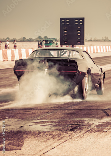 Dragster sets off on the racetrack. Dragster on the speedway. Drag wheel, torque, power, engine power.	
