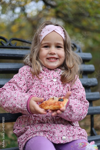 little girl eating cream