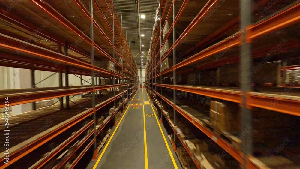 Pathway between racks with lines for vehicle and walking in plant ...